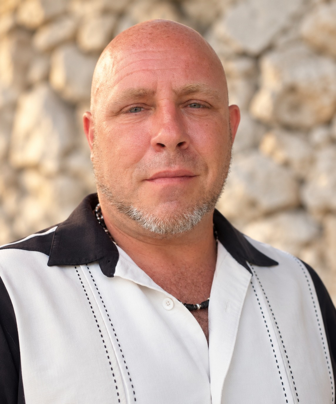 Ron Devine in a black-and-white shirt